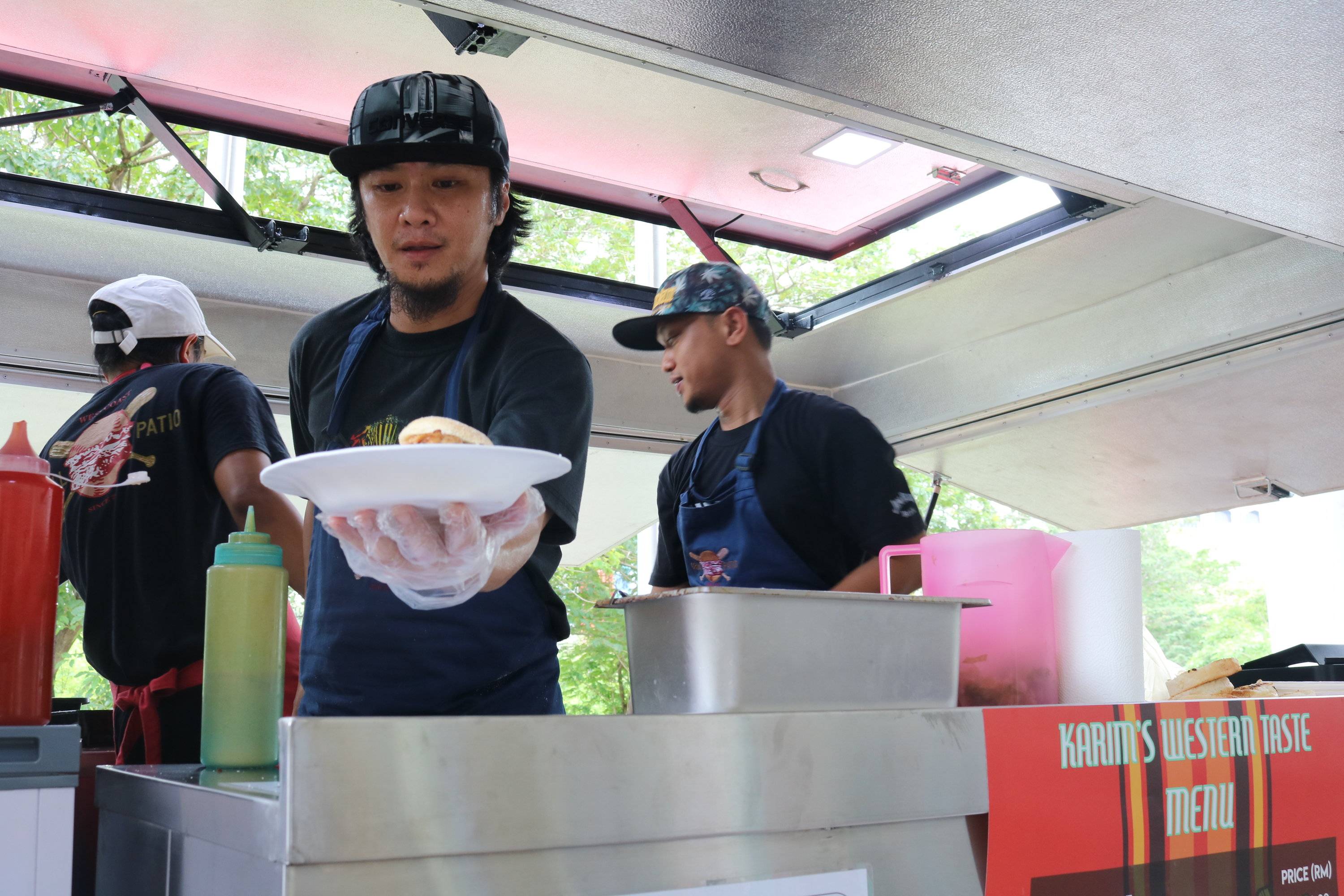 Chef serving food on Mobile Food Truck